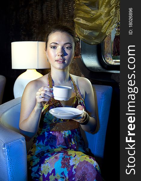 Woman Drinking Tea In Restaurant