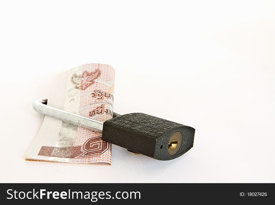 Padlock with banknote inside over white background