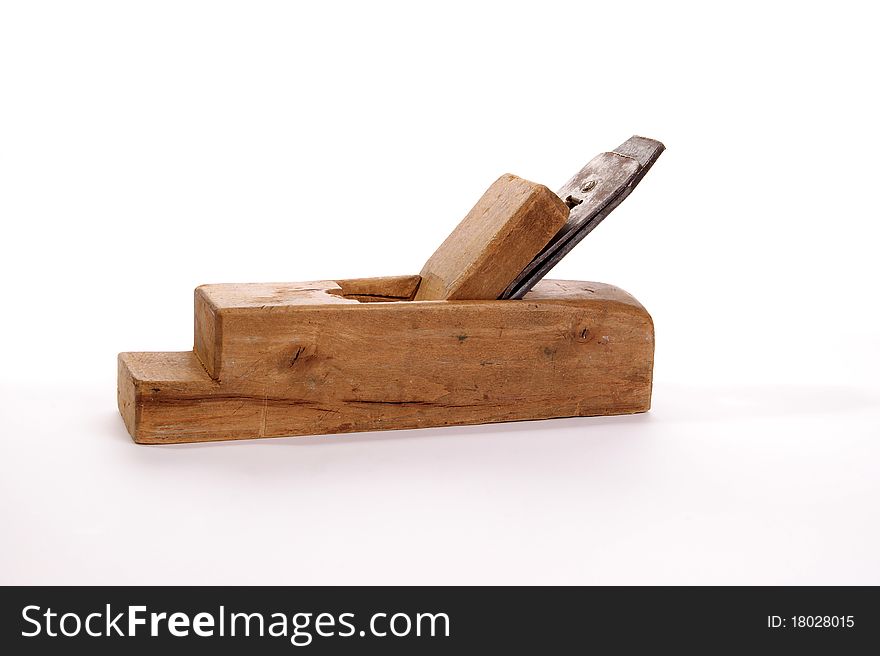 Old wooden planer close-up, white background