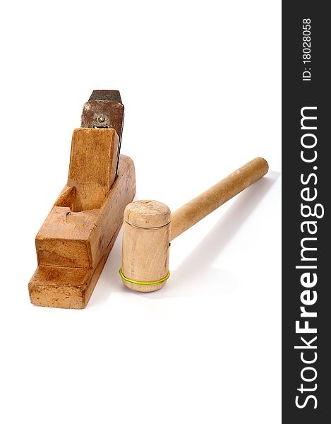 Old wooden planer and Mallet close-up, white background