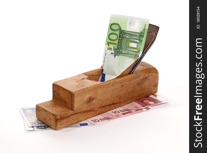 Work and earn. Old wood the planer and paper banknotes on a white background. Work and earn. Old wood the planer and paper banknotes on a white background