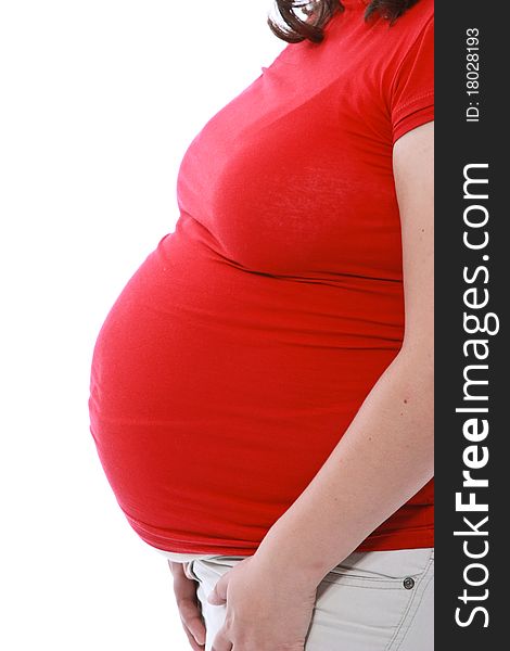 Close up of a pregnant belly over white background