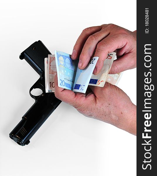First plane of hands counting euro notes and gun has more than enough white bottom. First plane of hands counting euro notes and gun has more than enough white bottom