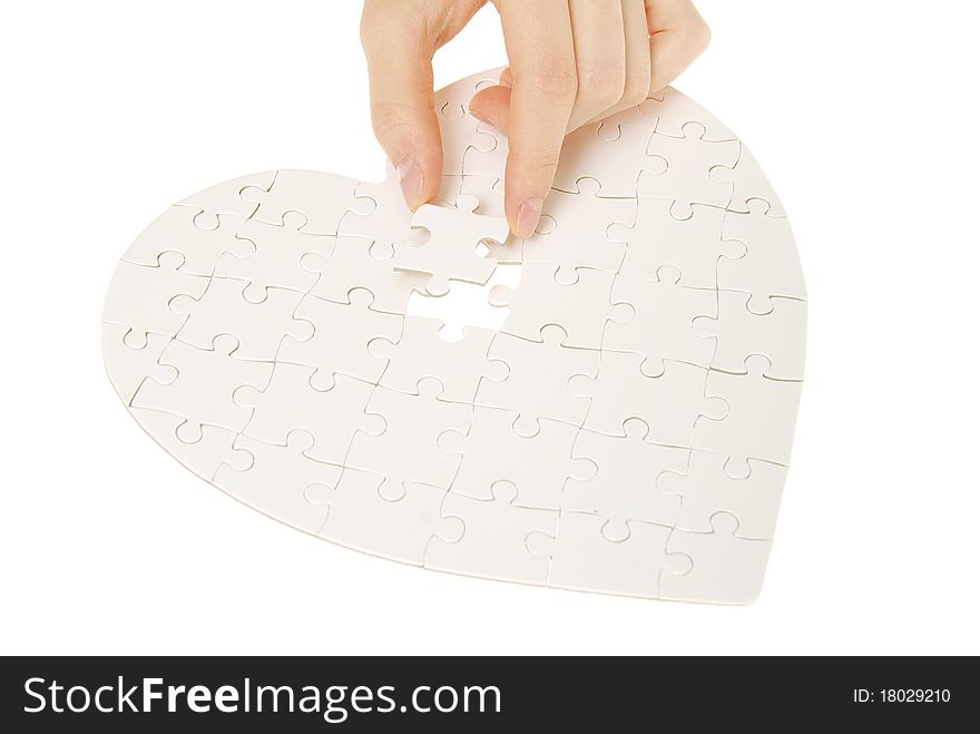 Puzzle heart isolated on a white background