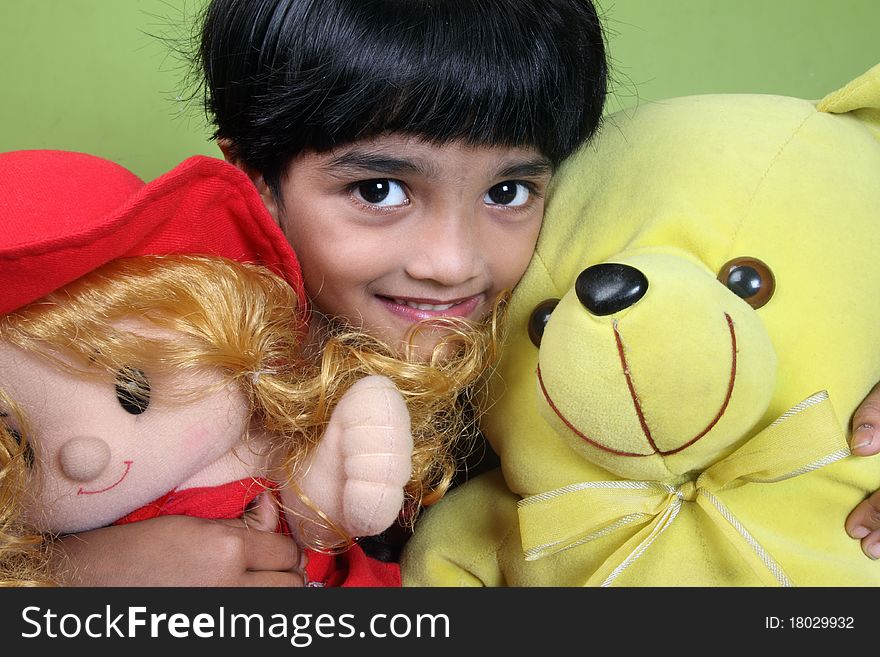 Indian Little Girl Holding The Dolls