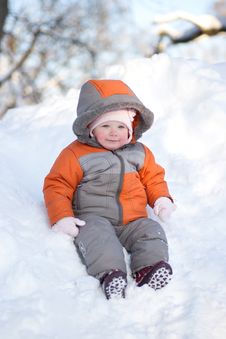 Adorable Baby Sliding Down From Hill Royalty Free Stock Photos