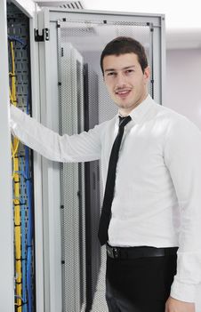 Young It Engeneer In Datacenter Server Room Stock Images Young It Engeneer In Datacenter Server Room Stock Images