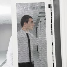 Young It Engeneer In Datacenter Server Room Royalty Free Stock Photo Young It Engeneer In Datacenter Server Room Royalty Free Stock Photo