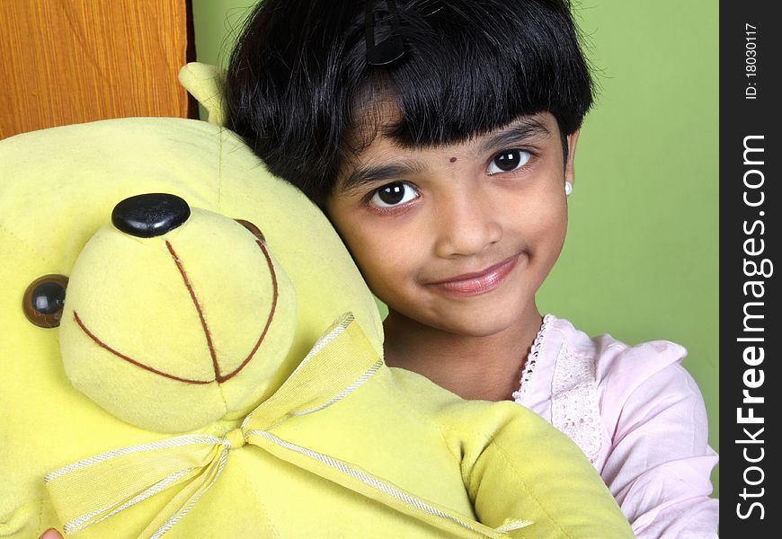 Indian Little Girl Holding The Ctue Doll. Indian Little Girl Holding The Ctue Doll