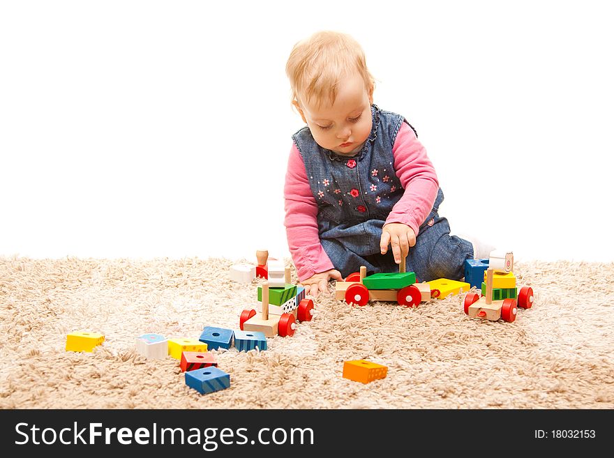 Cute little girl playing with wood toys. Cute little girl playing with wood toys