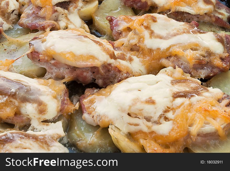 Fried meat with melted cheese on. Fried meat with melted cheese on