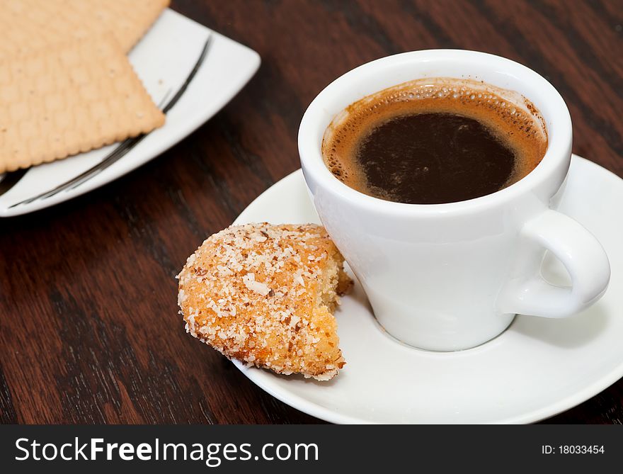 Cup of delicious coffee with biscuits. Cup of delicious coffee with biscuits.