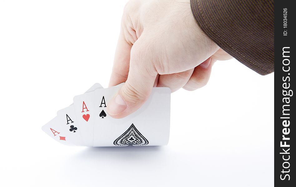 Player hand revealing four aces on white background