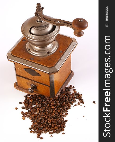 Old coffee grinder on a white background.