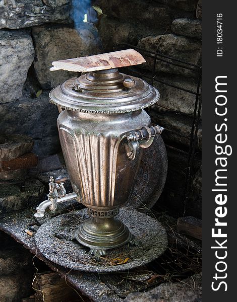 The antiquarian russian samovar with smoke