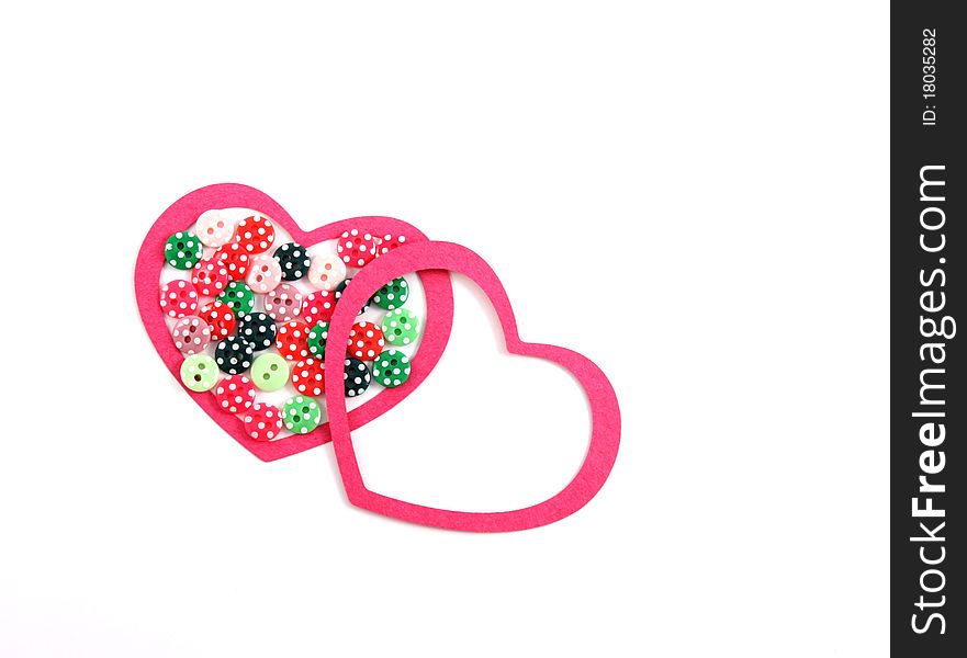 Red hearts and colorful buttons on white background