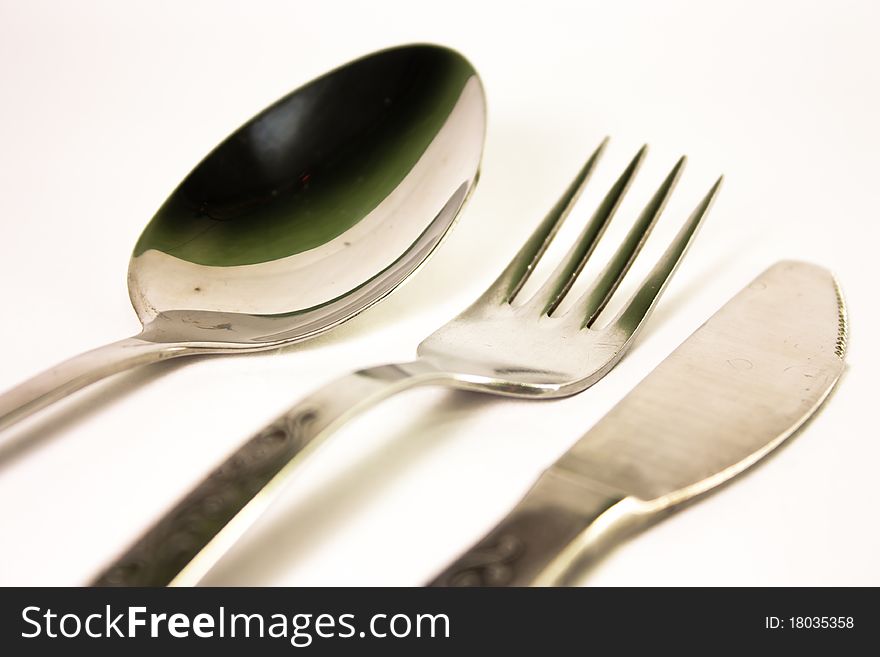 Spoon fork and knife on the white background