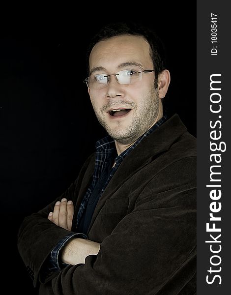 Portrait of a man, isolated over black background. Portrait of a man, isolated over black background