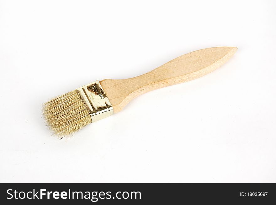 Wooden brush on a white background