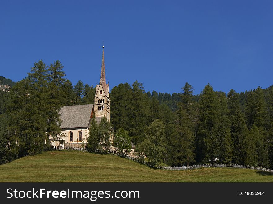 A small church surrounded by forest in Italian Alps. A small church surrounded by forest in Italian Alps