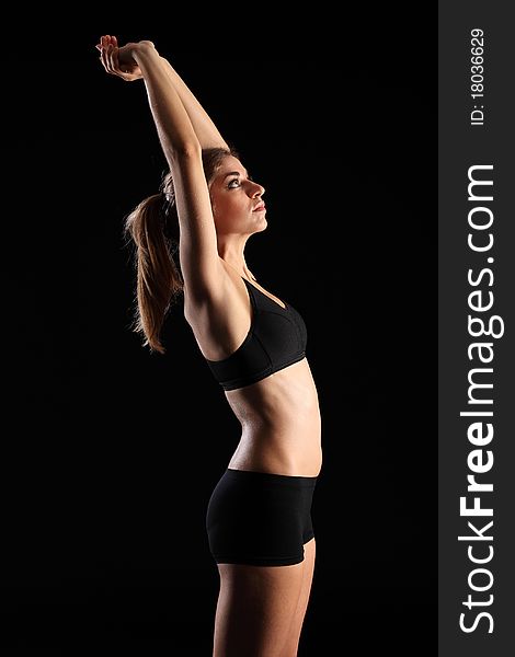 Woman In Sports Outfit Stretching Arms Above Head
