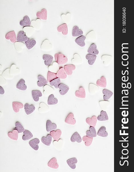 Heart shaped candy sweets on white background