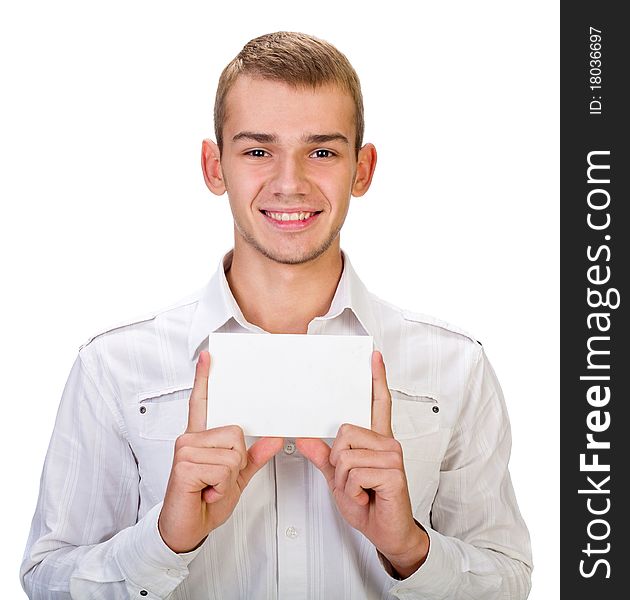 Portrait of a happy young man holding a blank board for texting against white