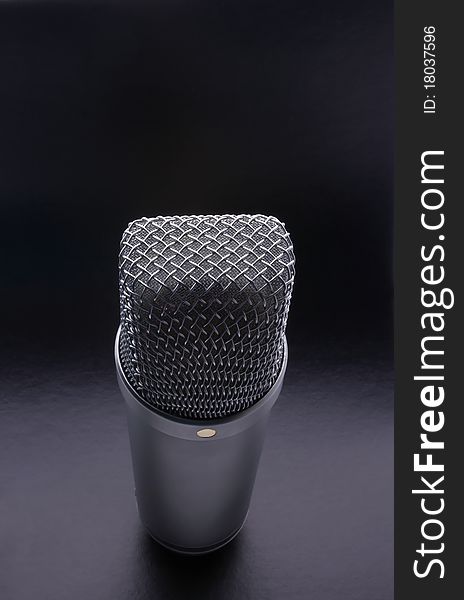 Studio microphone for recording on a black background