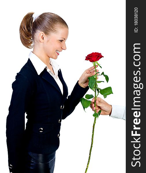 The man gives to the beautiful girl a red rose.