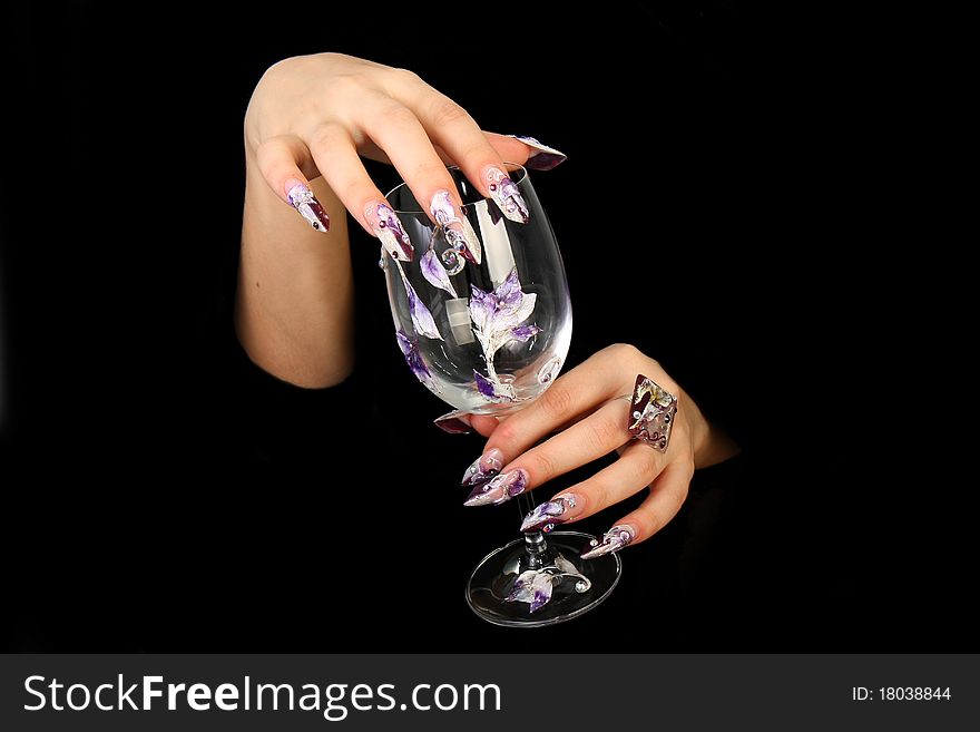 Human fingers with long fingernail and beautiful manicure isolated on black