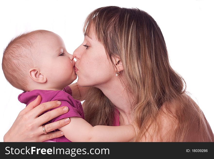 Mother kissing daughter isolated on white. Mother kissing daughter isolated on white