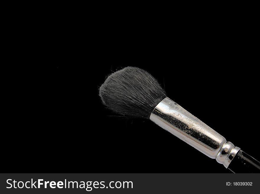The makeup brush and cosmetic powder compact. The makeup brush and cosmetic powder compact