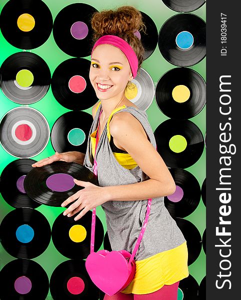 Studio shot of cheerful teenage girl over colorful background