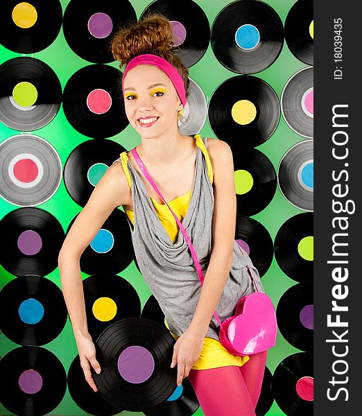 Studio shot of cheerful teenage girl over colorful background