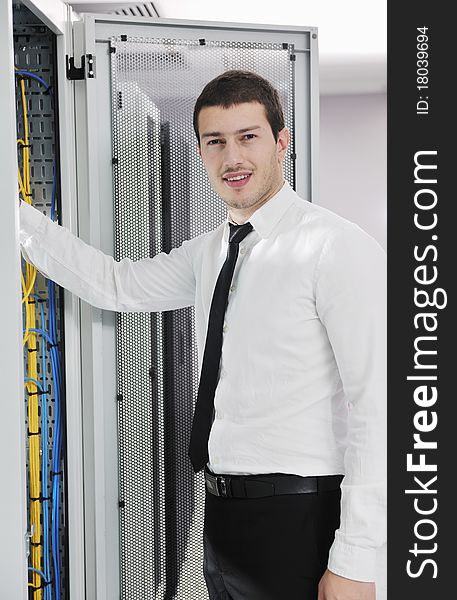 Young It Engeneer In Datacenter Server Room