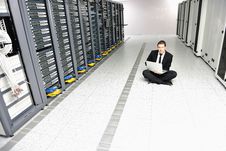 Young It Engeneer In Datacenter Server Room Stock Photo Young It Engeneer In Datacenter Server Room Stock Photo