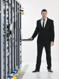 Young It Engeneer In Datacenter Server Room Royalty Free Stock Photos Young It Engeneer In Datacenter Server Room Royalty Free Stock Photos