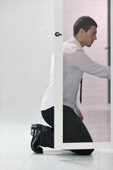 Young It Engeneer In Datacenter Server Room Stock Photos Young It Engeneer In Datacenter Server Room Stock Photos