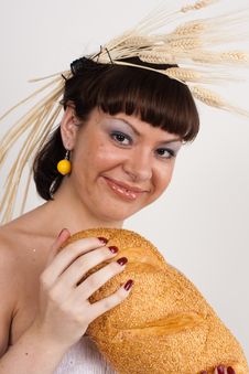 Girl With Bread And Ears Of Wheat Stock Image