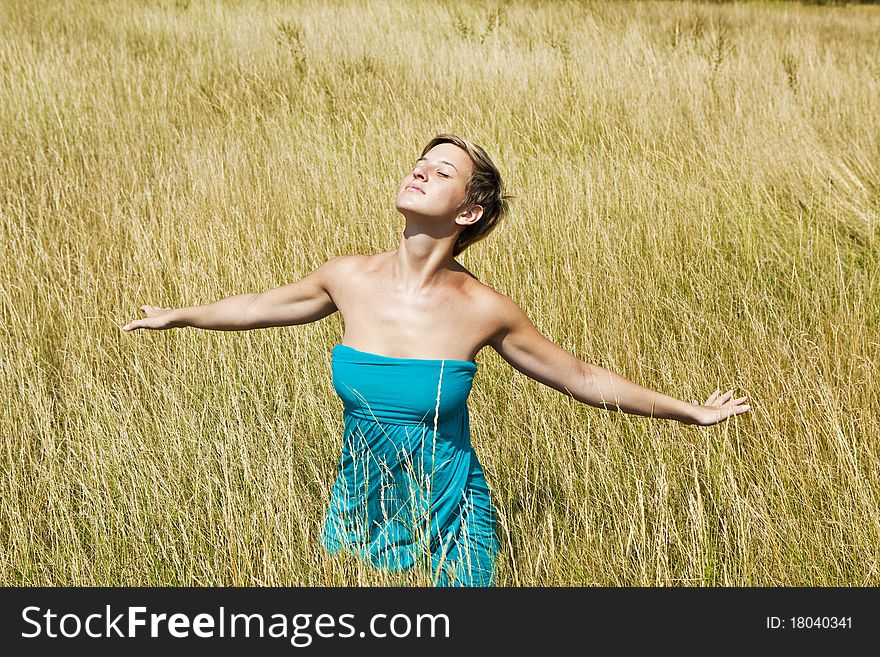 Young woman relaxing in a field