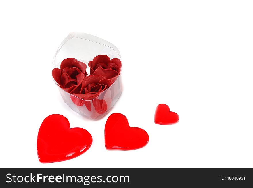 Box with roses and heart is isolated on a white background