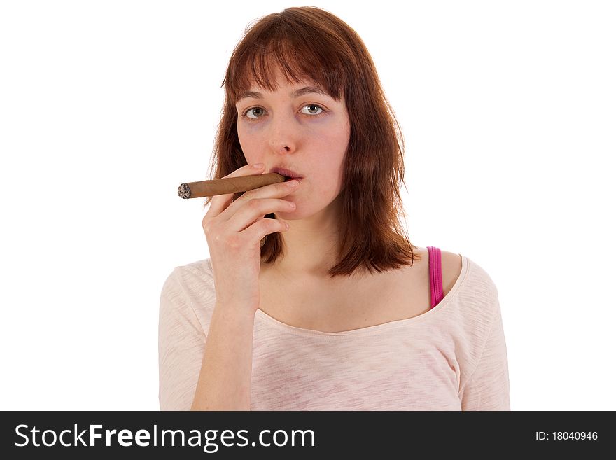 A young woman is smoking a thick cigar. A young woman is smoking a thick cigar