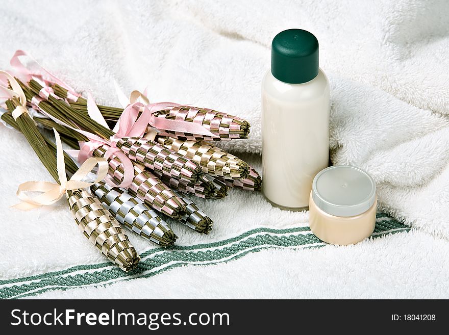 Cosmetics and lavender on the towel