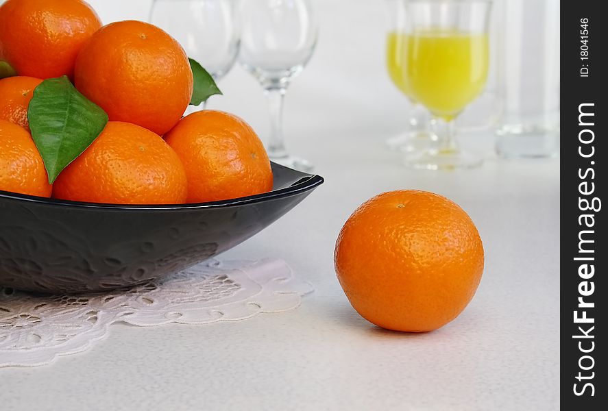 Mandarines in a vase on a table