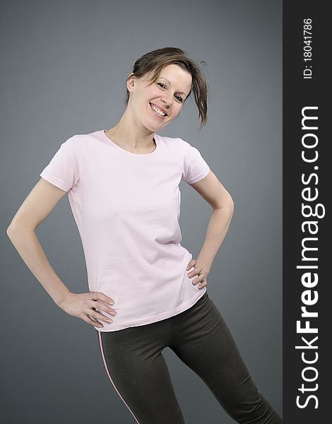 Happy white woman teaching aerobic exercises. Happy white woman teaching aerobic exercises