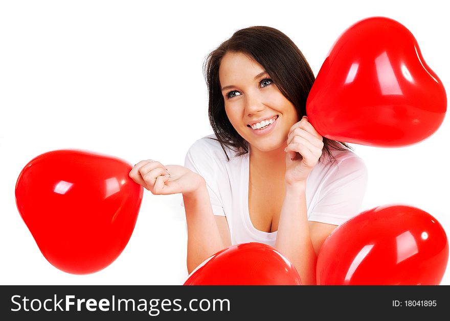 Young brunette with red hearts isolated