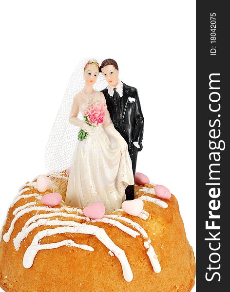 Bride groom figurines on a cake isolated