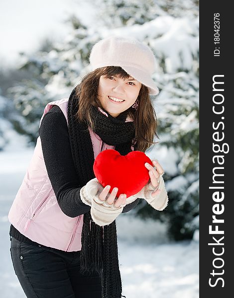 Teen girl heart in his hands at the Winter Park