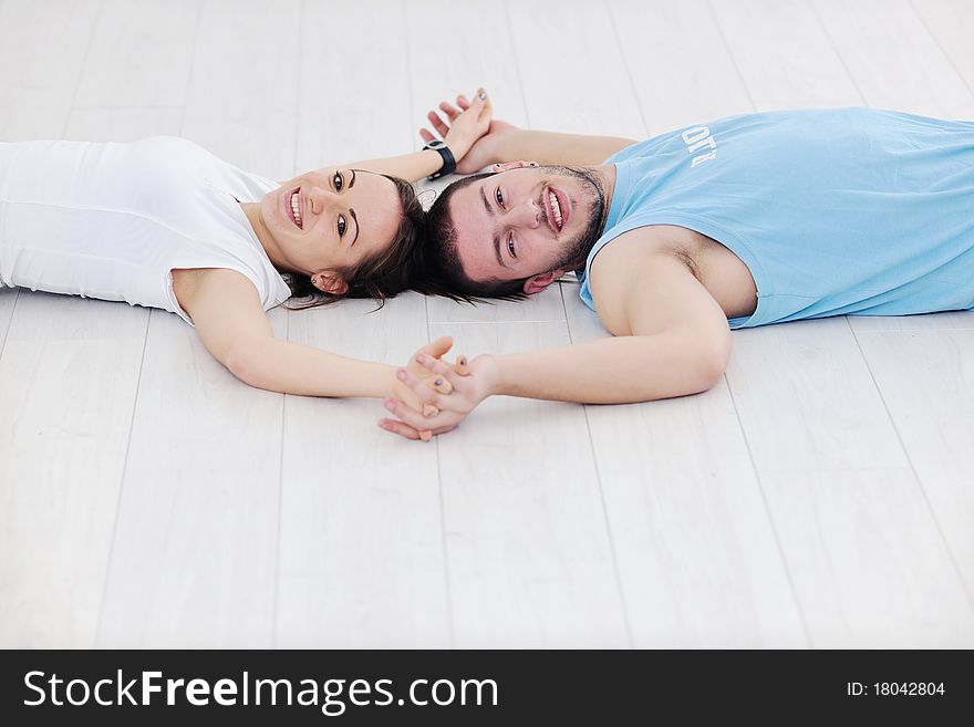 Young man in fintess sport club exercise withweights and relaxing. Young man in fintess sport club exercise withweights and relaxing