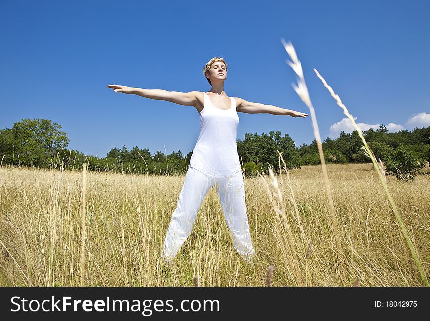 Young woman practicing yoga outdoor